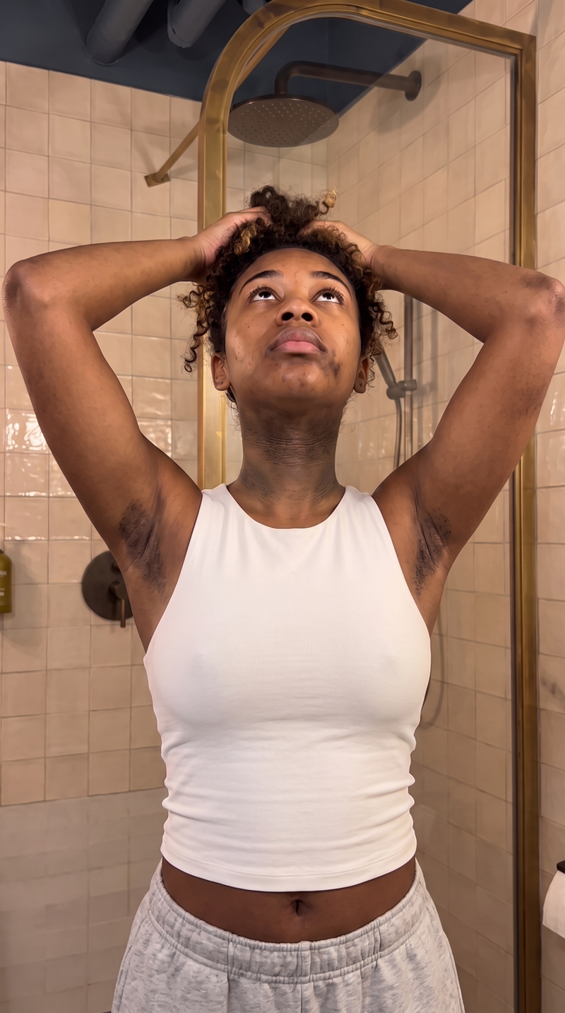 Woman with her head tilted back showing uneven tone on her neck